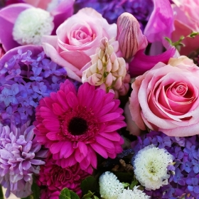 Pink and purple florists choice hand tied bouquet